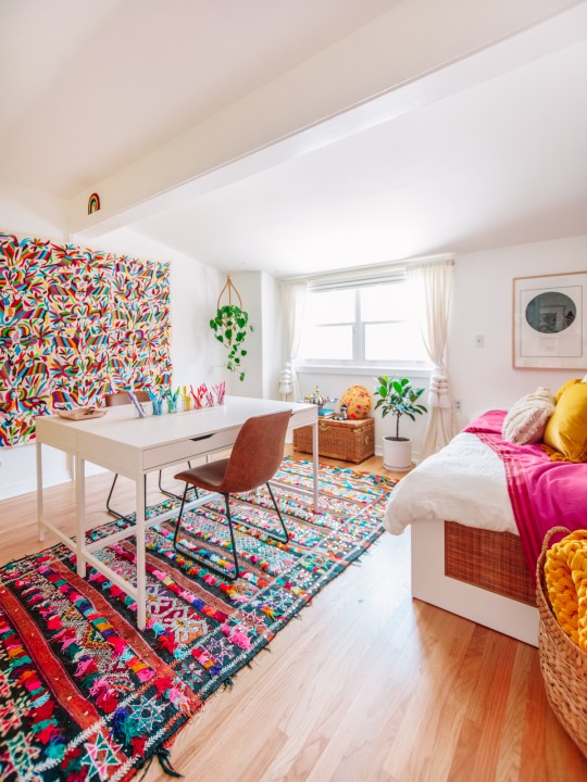 Colorful Home Office Guest Bedroom with Moroccan Rugs and Otomi Tapestry