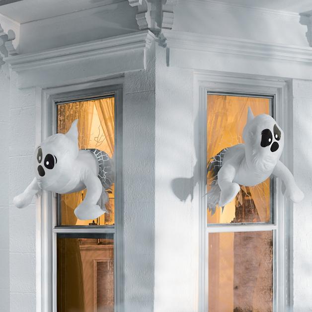 Plush ghosts crashing through the windows of a White House