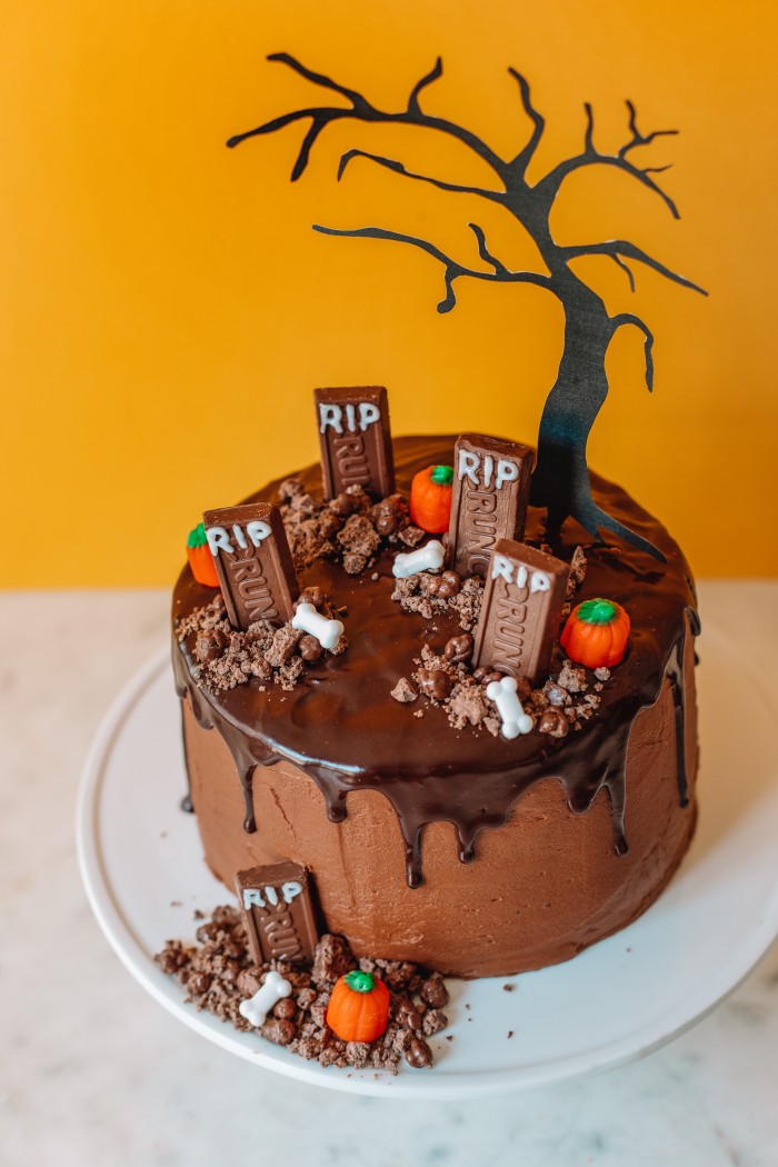 Crunch Bar Graveyard Cake with orange background
