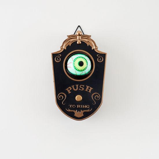 Eyeball Doorbell on a White Wall