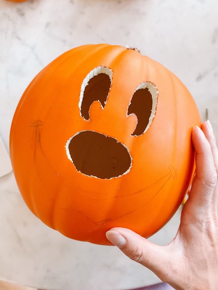 pumpkin with mickey face partially carved