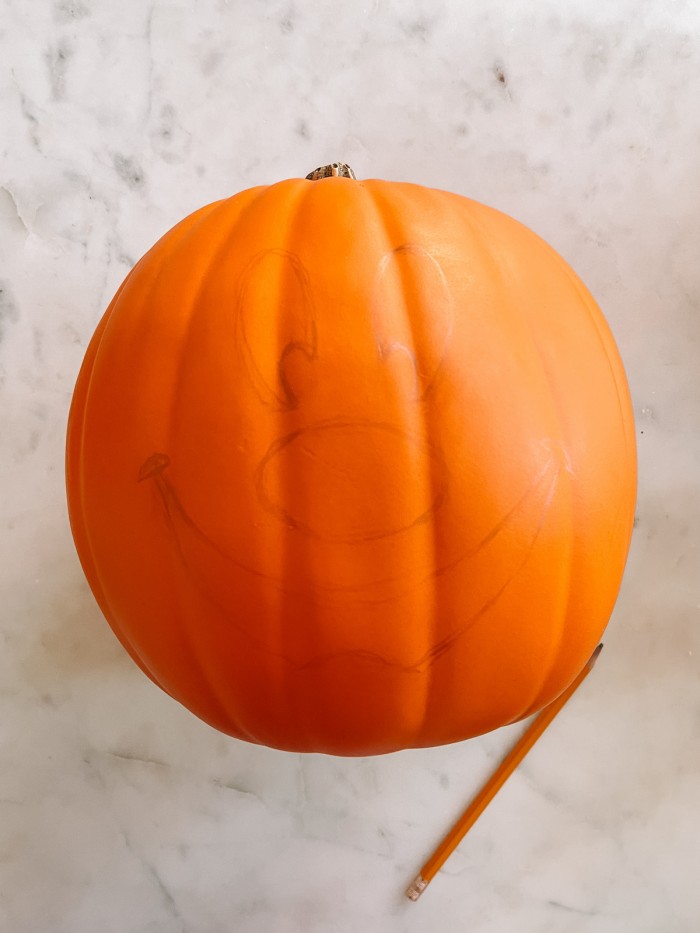 pumpkin with Mickey face drawn on