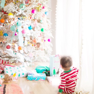 Baby's First Christmas Ideas & Traditions Baby looking at Christmas tree