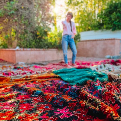 Where To Splurge and Save When Decorating & Renovating Moroccan Rugs laid out outside