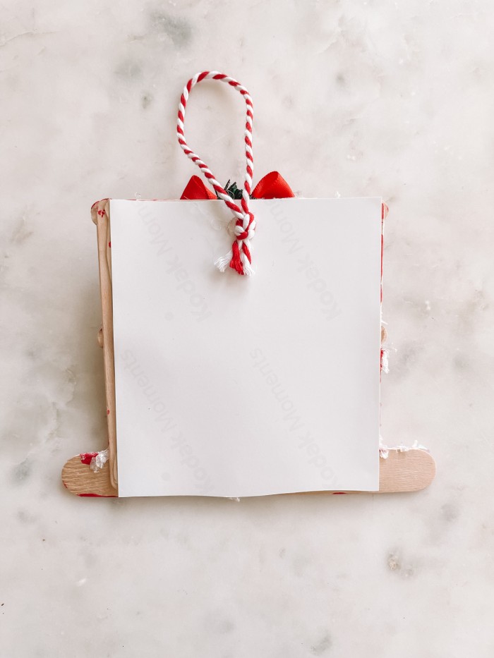 Photo backing on back of popsicle stick ornament