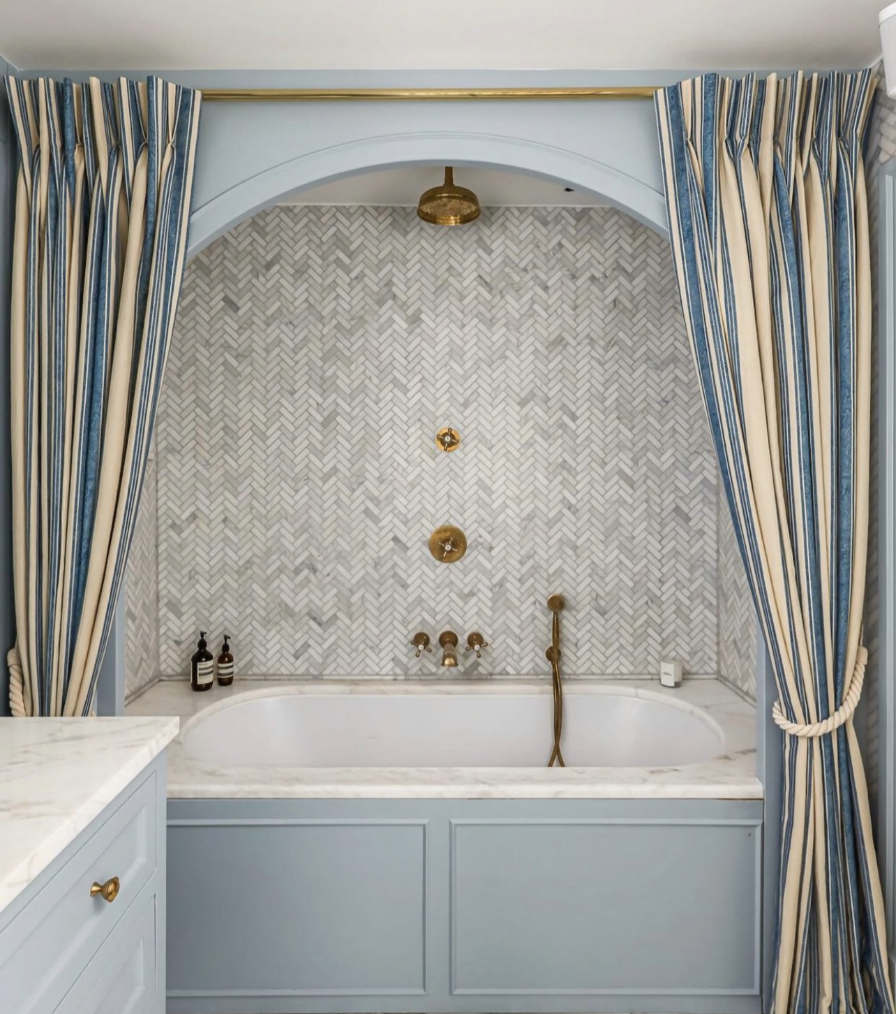 striped shower curtain above bathroom