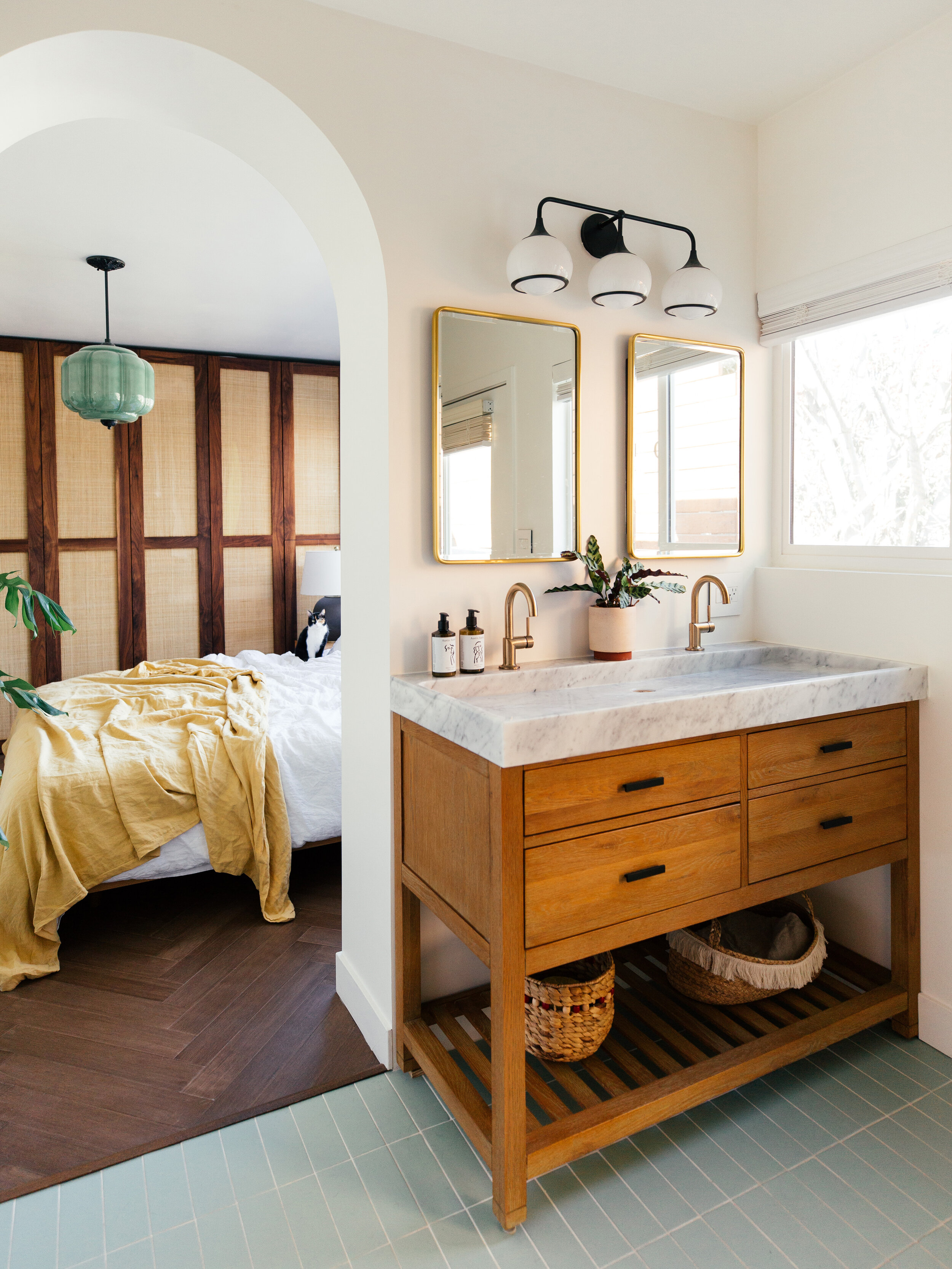 bathroom vanity with bedroom behind it