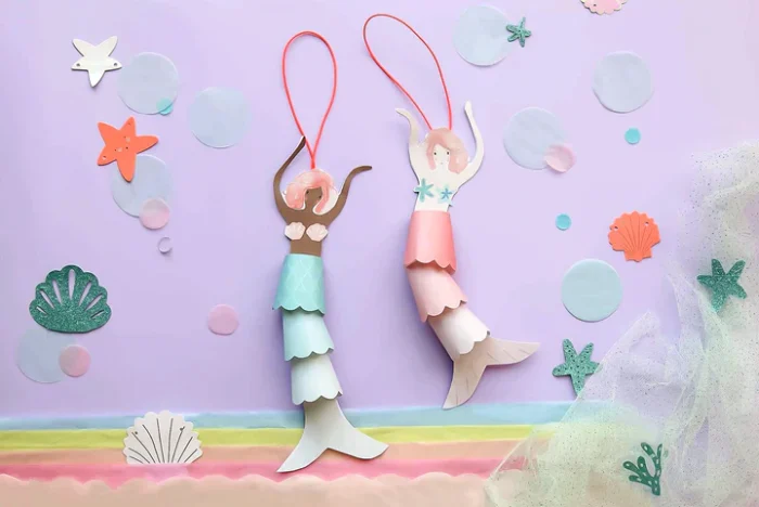 Mermaid decorations craft on paper.