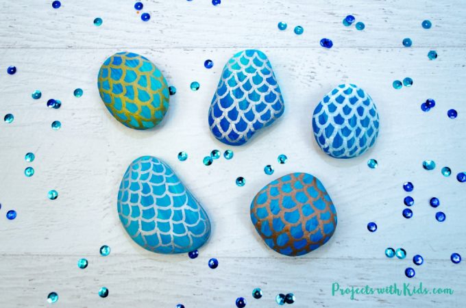 Painted rocks on a table.