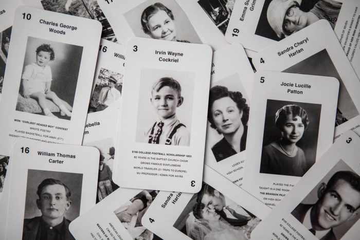 Playing cards with photos and text on them.