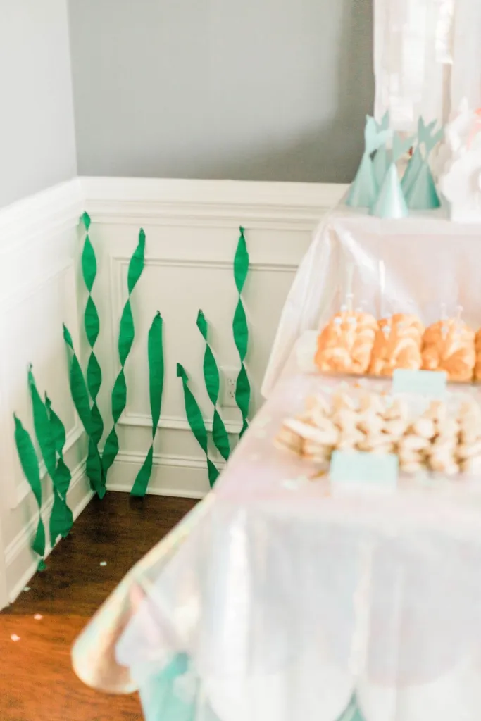 Seaweed streamers attached to the wall.