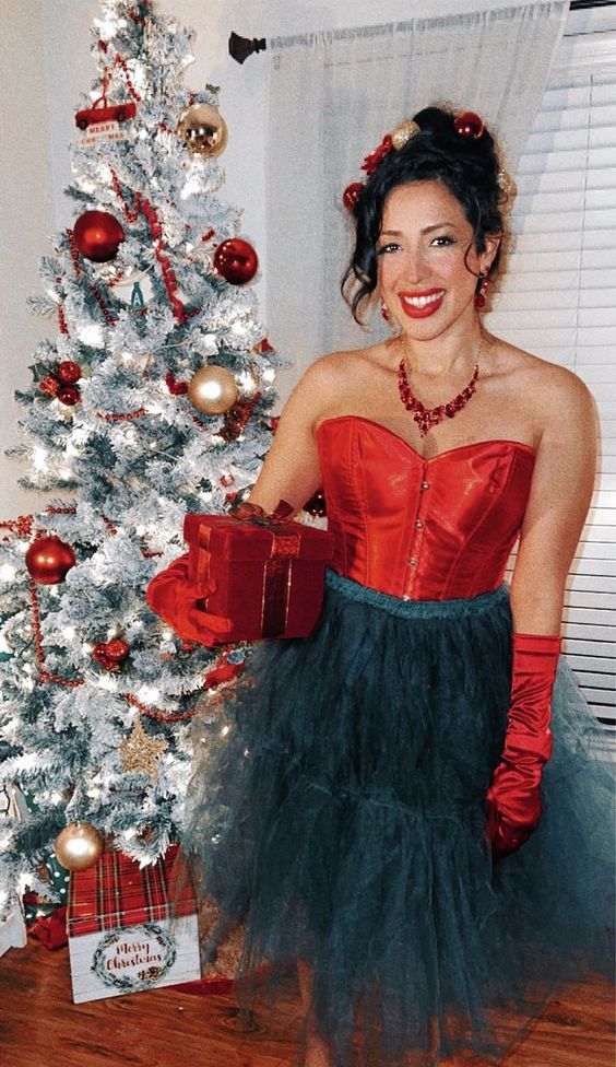 Martha May Christmas Costume Woman dressed as Martha May Whovier in front of a Christmas tree.