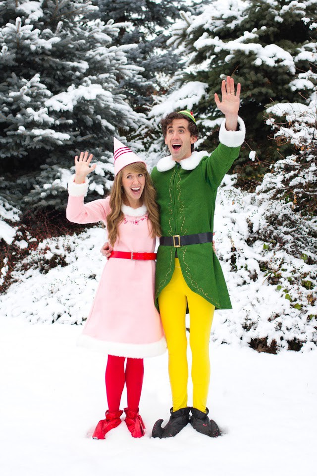 Elf Christmas Costume Man and woman dressed as elves and waving while standing outside in the snow.