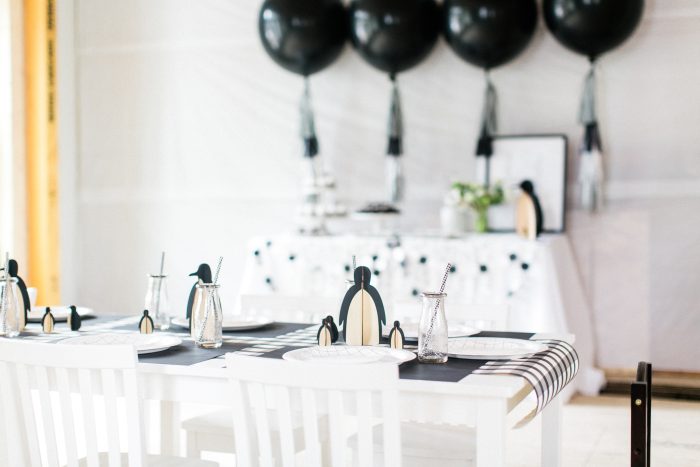 Penguin party with a table with penguin decorations. 