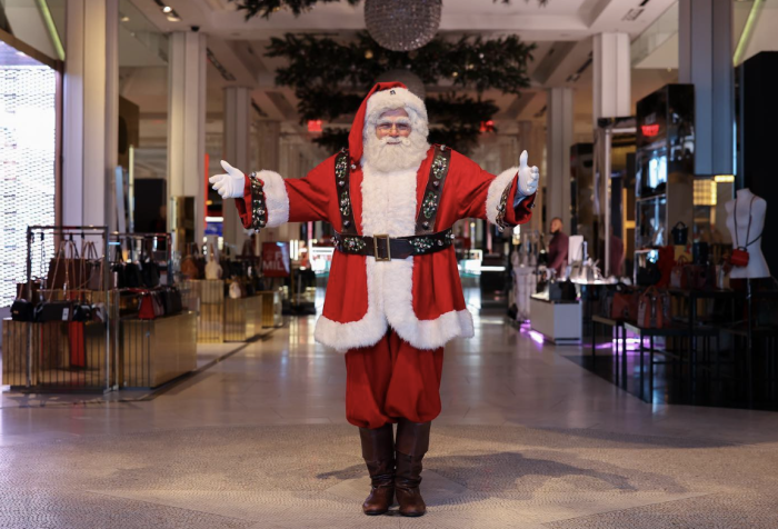 Santa Costume Idea Man dressed as Santa in a shopping mall.