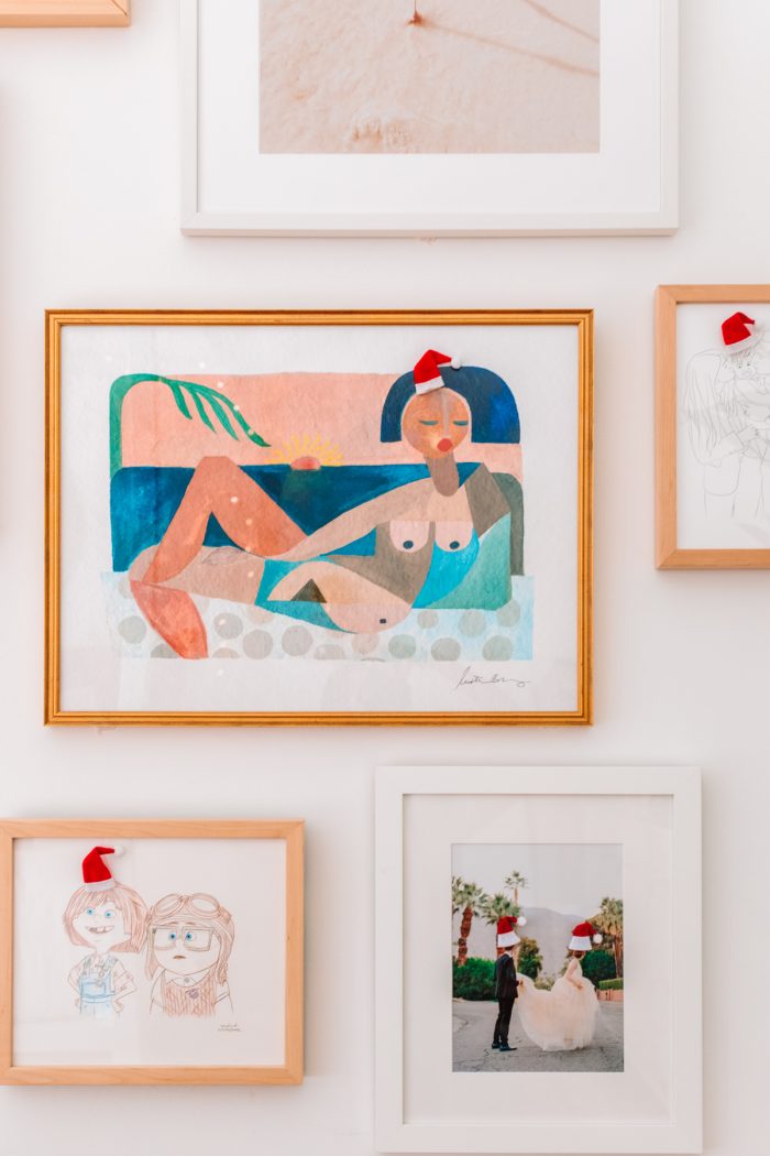 Ideas for a Christmas Bucket List Photos on the wall with little Santa hats on their heads.