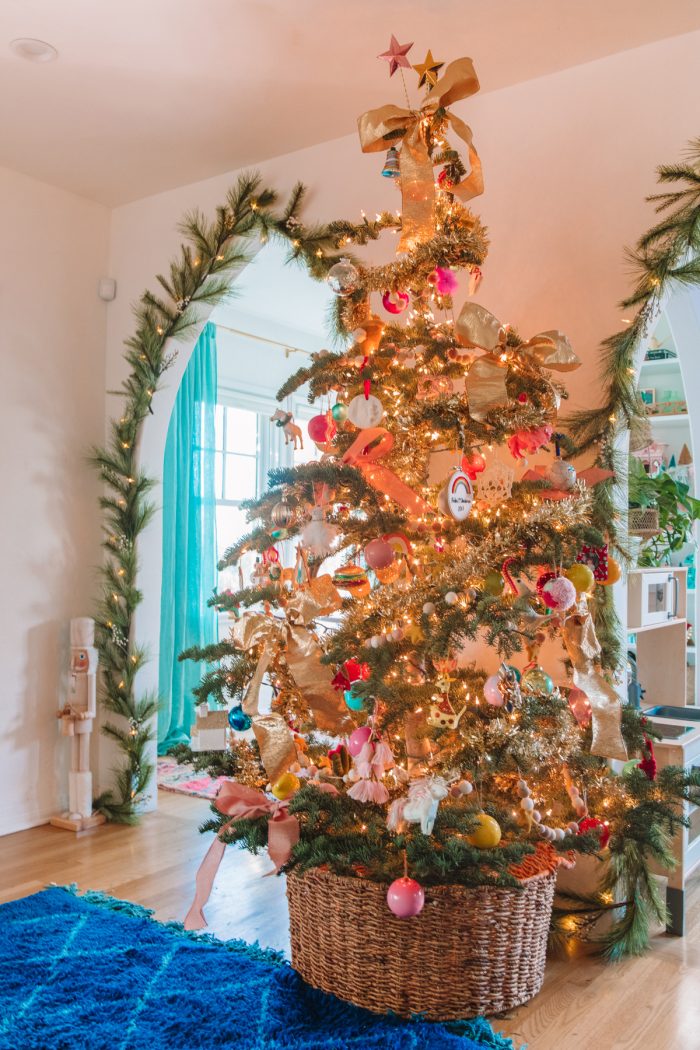 Christmas tree decorated with lots of ornaments. 