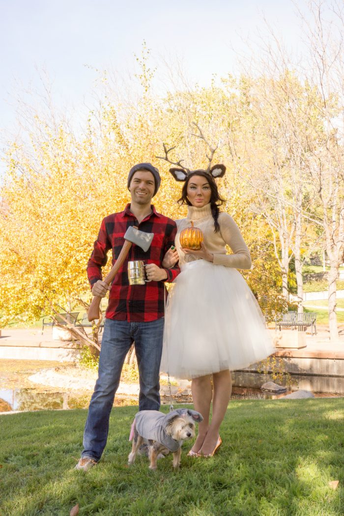 Christmas Costume Ideas A man, woman and dog dressed up as a lumberjack, deer, and mouse and standing outside.
