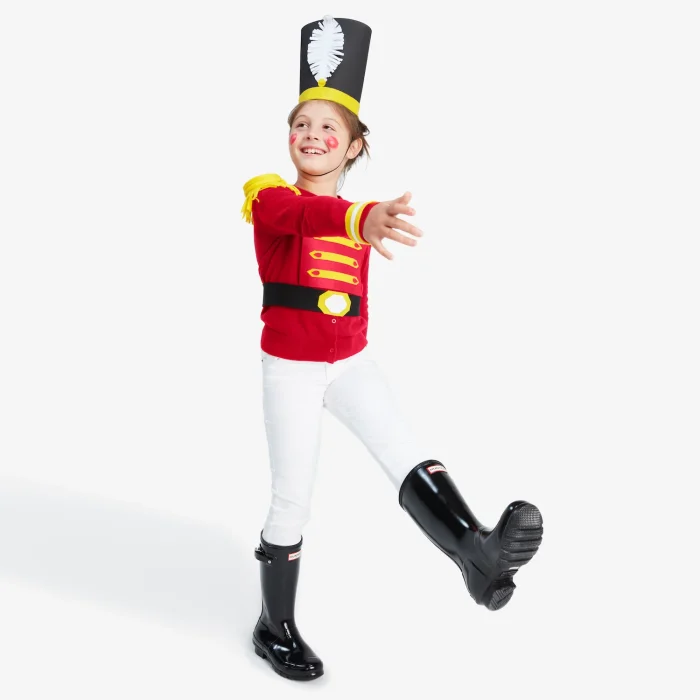 Nutcracker Costume Person standing with one leg up in a walking motion wearing a nutcracker costume.
