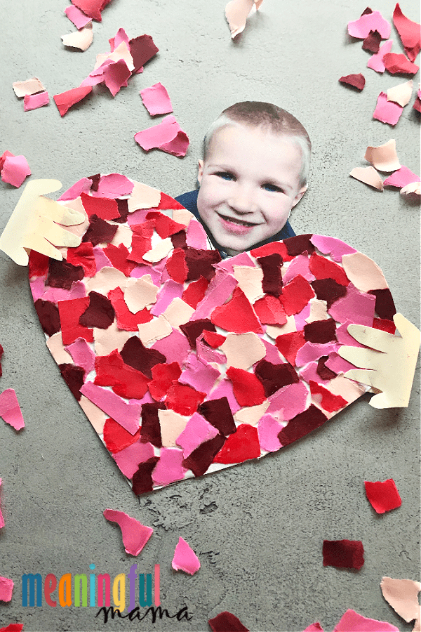 Mosaic Heart Craft Child's photo with a heart made out of torn up paper.