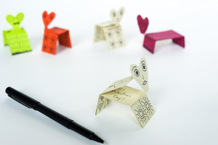 Valentine's Card Creatures Printable and foldable valentine creatures next to a pen.