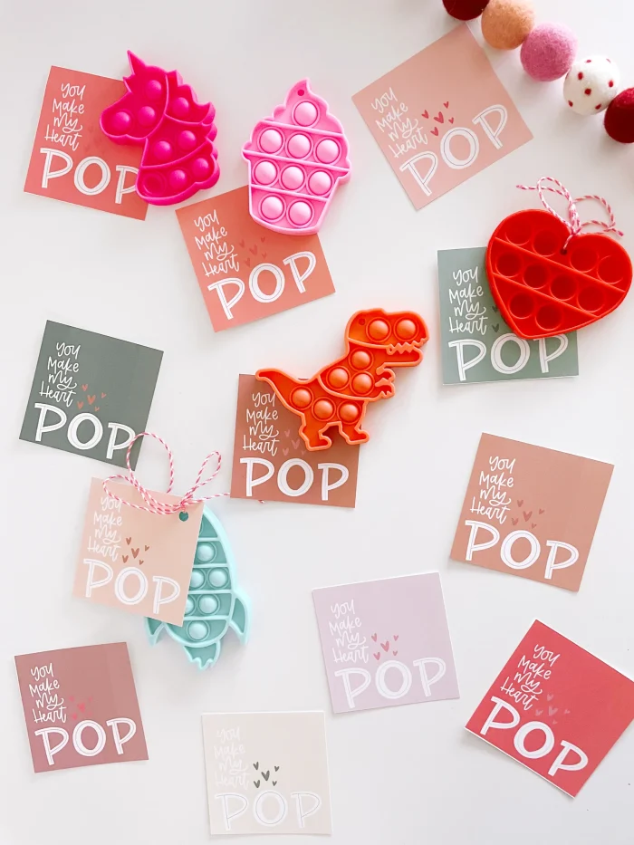 Pop Its Valentines Mini Pop its attached to valentine's cards.