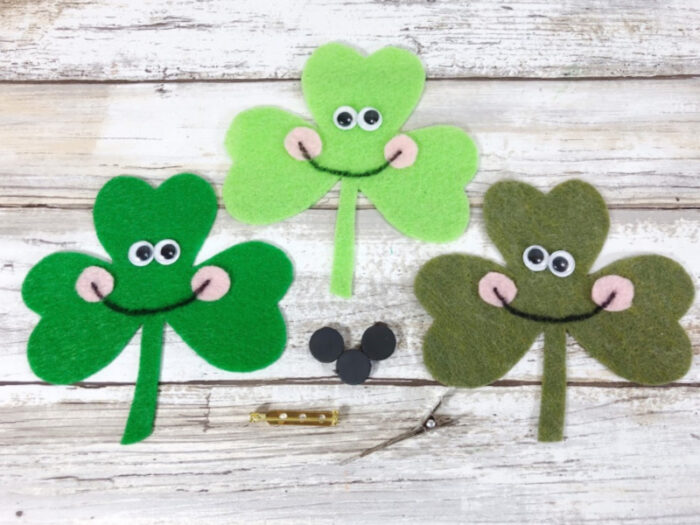 Three shamrocks made out of felt. 