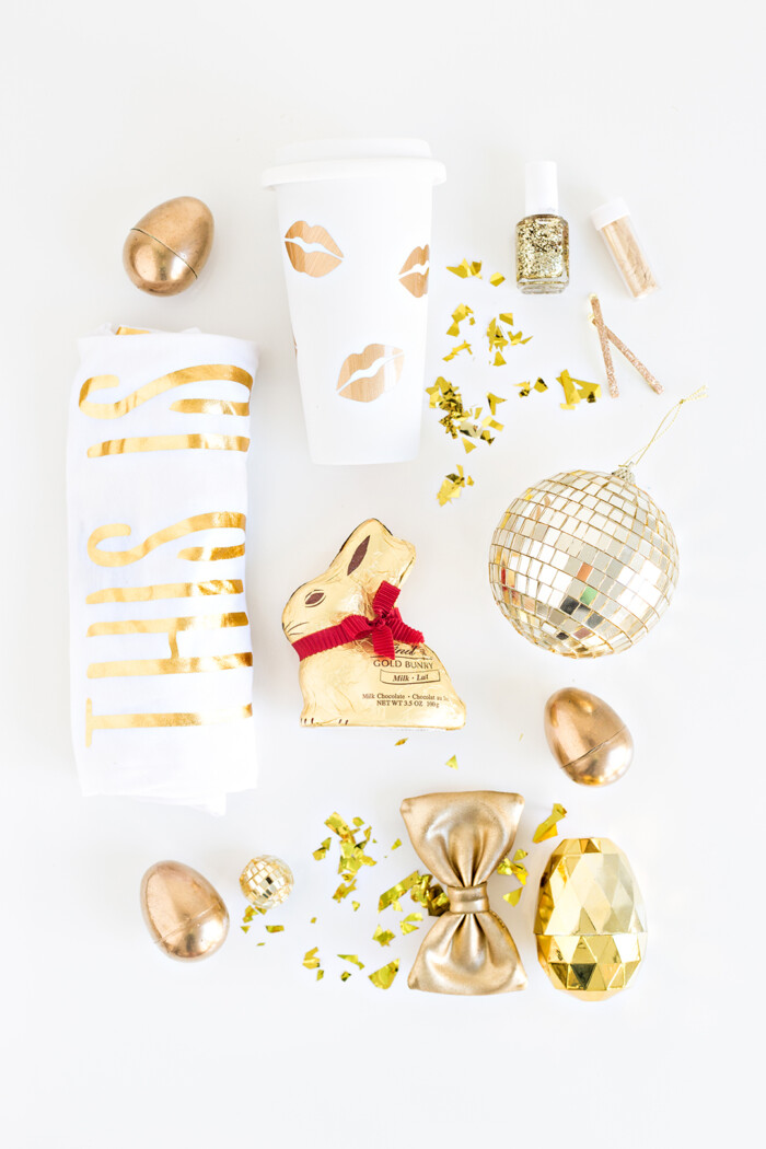 Practical Easter Baskets Gold-themed Easter basket fillers including a t shirt and chocolate.