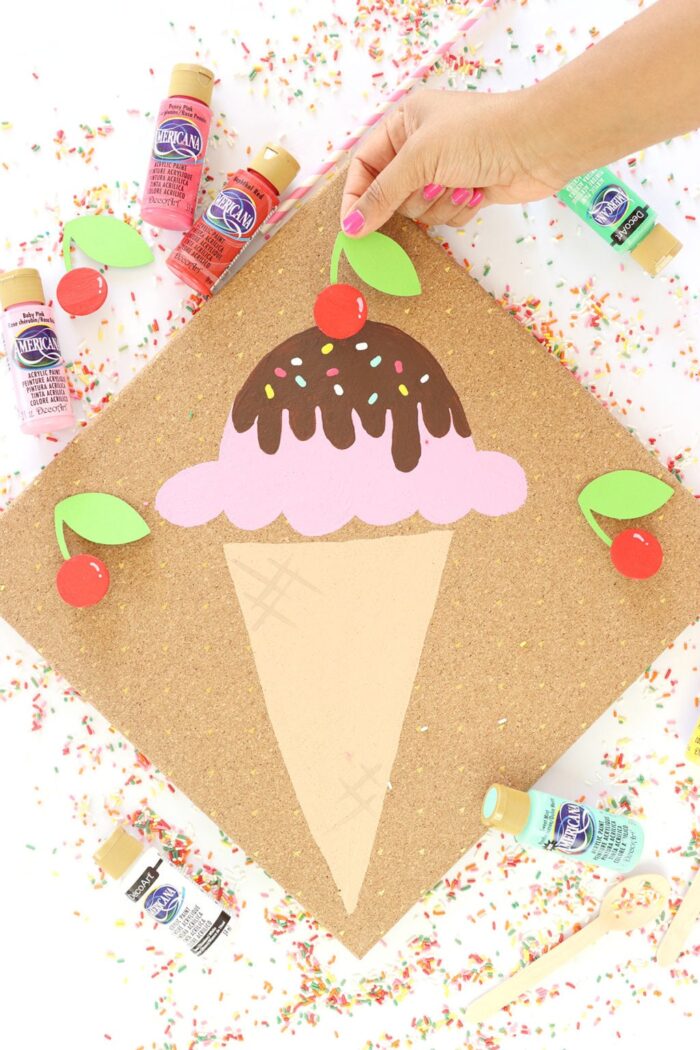 Ice Cream Party Ice Cream craft with a hand placing the cherry on top.