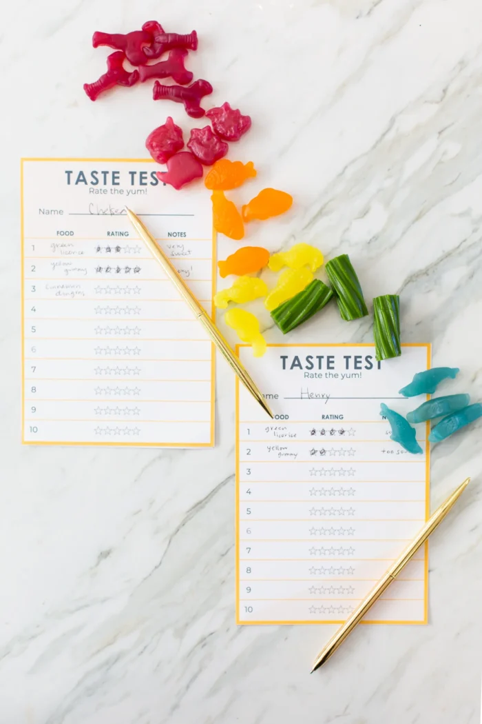 Taste Test Party Gummies on a counter next to papers that say "taste test".