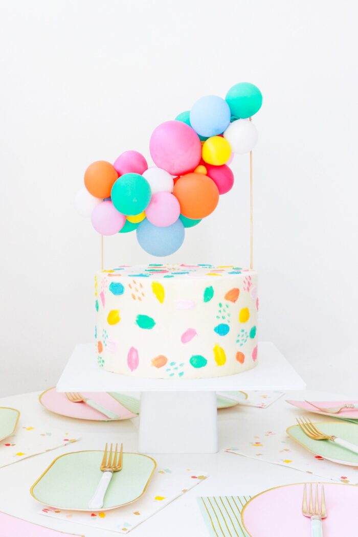 Balloon Cake Topping Birthday cake with a mini balloon topping on top.