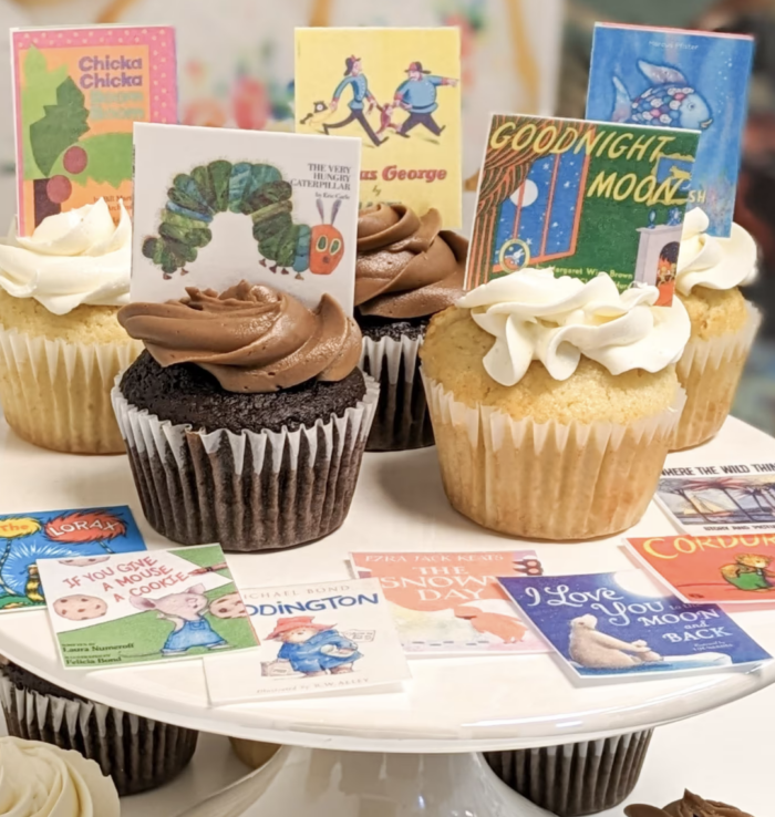 One for the Books Birthday Party Cupcakes with printed book designs.