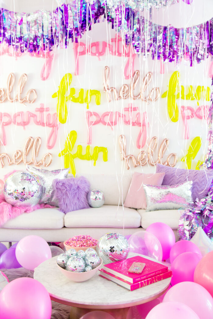 Slumber Party Scene of living room with balloons everywhere and text balloons on the wall.
