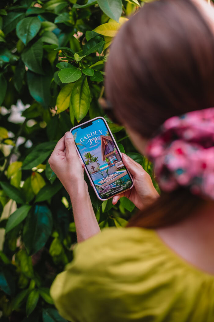 woman on phone playing Garden Joy